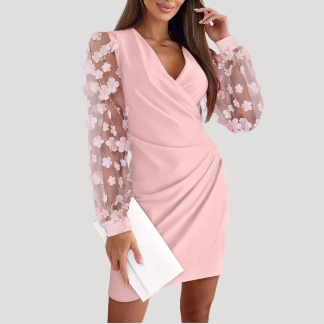 Women's black mini wrap dress with sheer chiffon sleeves, deep V-neckline, and tailored silhouette