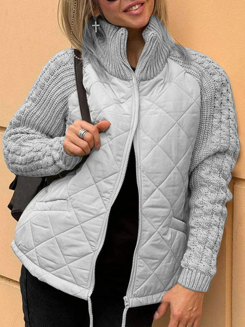 Women's quilted zip-up jacket with textured sleeves, funnel neck, lightweight mixed-media design