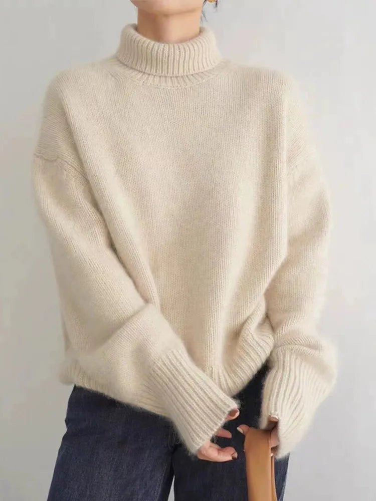 Women's relaxed-fit turtleneck sweater with ribbed neck, cuffs, and hem for modern slouchy style