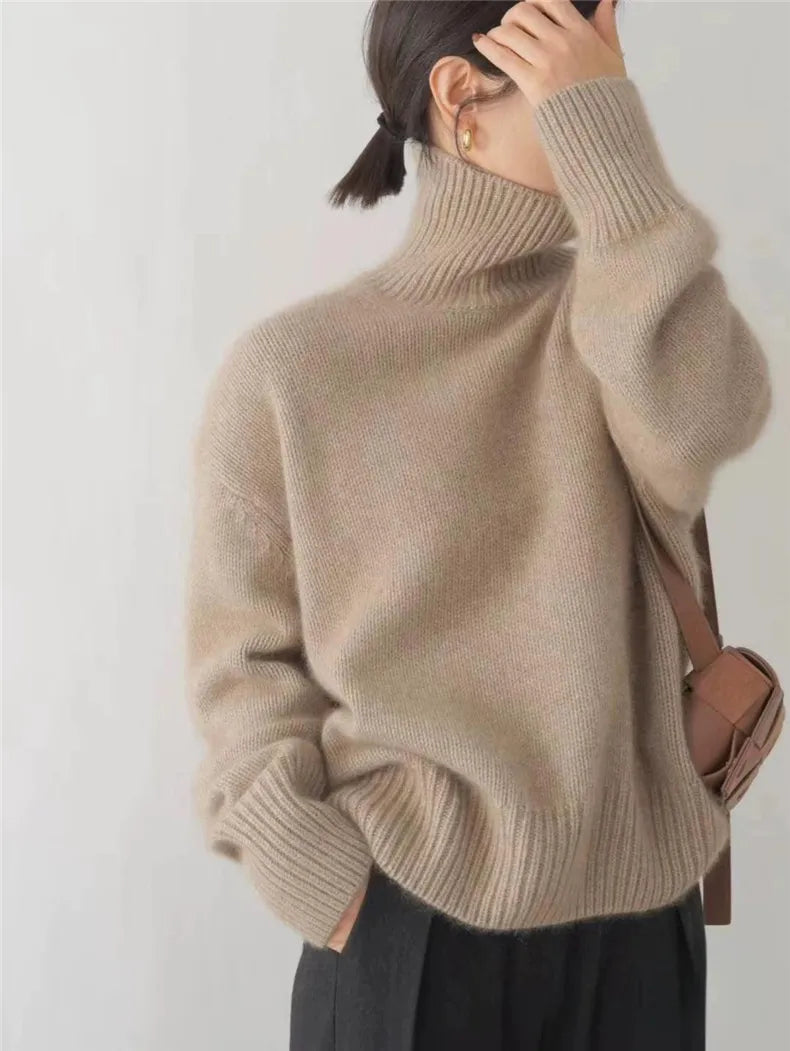 Women's relaxed-fit turtleneck sweater with wide ribbed cuffs, dropped shoulders, hip-length silhouette