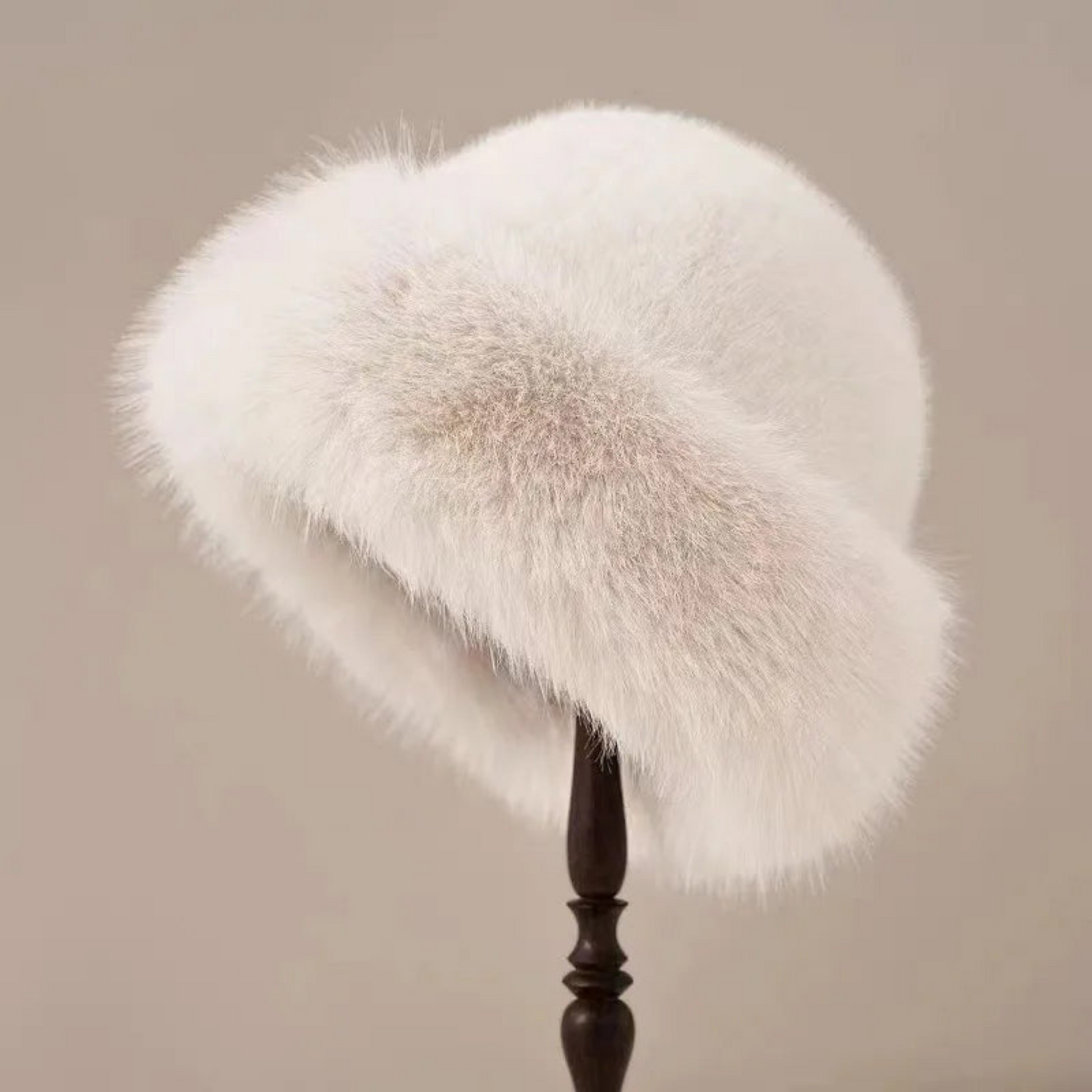 Women's vintage faux fur hat with rounded crown and plush wide trim for elegant winter style