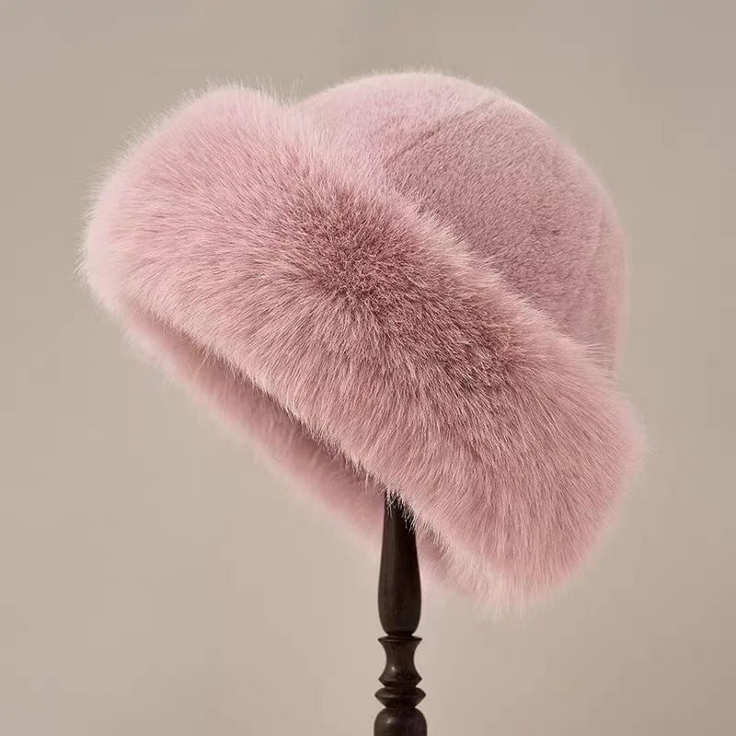Women's vintage faux fur hat with rounded crown and plush wide trim for elegant winter style