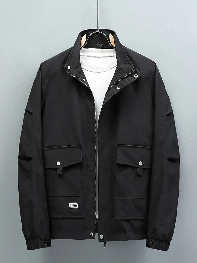 Men's navy blue winter sports jacket with durable weatherproof design for outdoor activities
