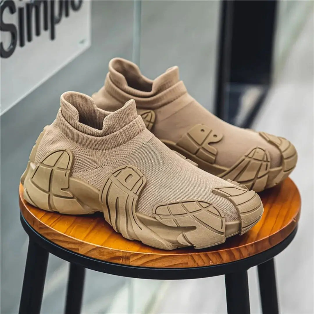 Black slip-on knit sneakers futuristic streetwear silhouette with breathable upper and rugged outsole