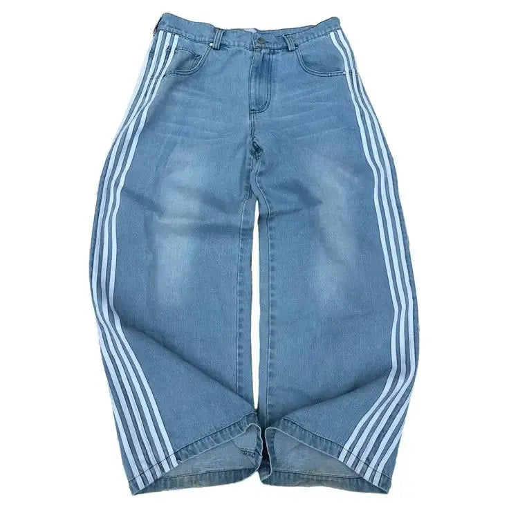 Baggy high waist jeans in blue Y2K retro style with bold sporty side stripes for streetwear