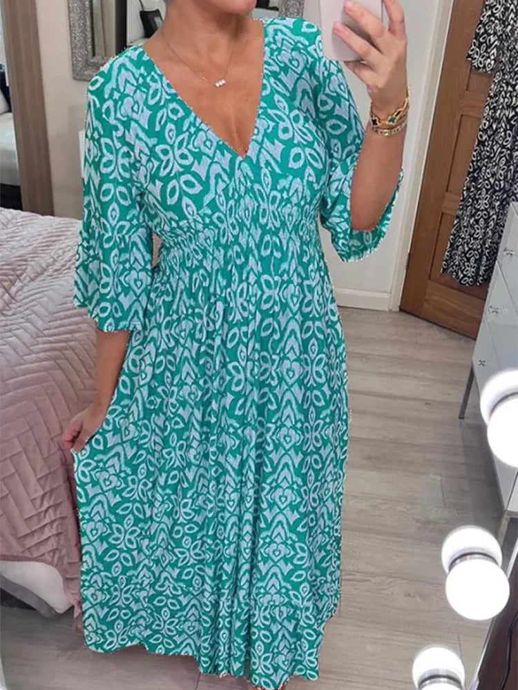Bohemian mosaic print maxi dress with V-neck, elastic waist, and ruffle hem in vibrant multicolor