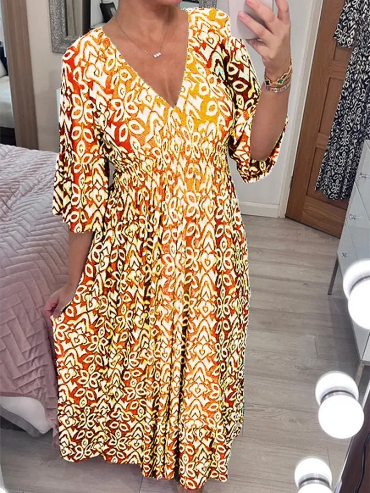 Bohemian mosaic print maxi dress with V-neck, elastic waist, and ruffle hem in multicolor