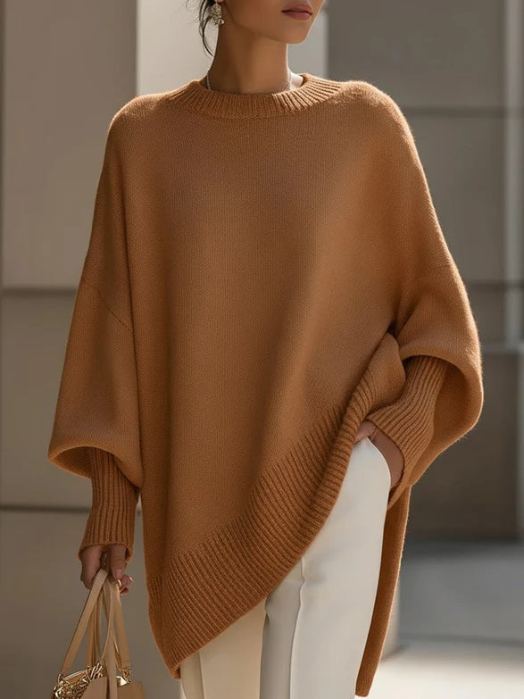 Women's oversized cozy sweater in neutral tone with draped silhouette and effortless luxe everyday style
