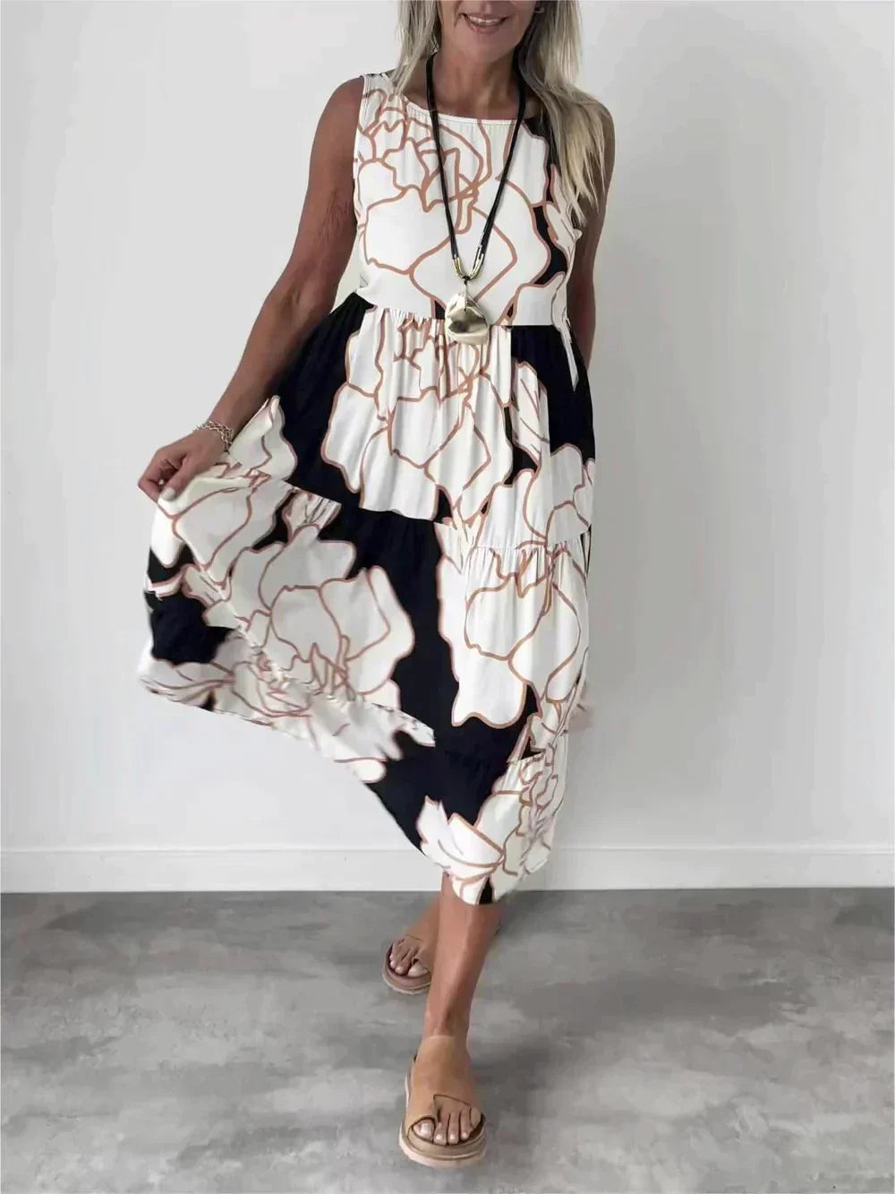 Women's sleeveless elegant cotton dress with unique print, polished silhouette for warm-weather outings