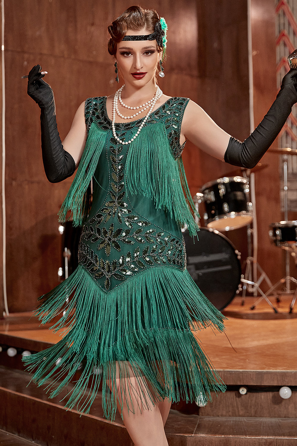 Black sleeveless 1920s flapper dress with pearl sequins, cascading fringe hem, vintage glam party style