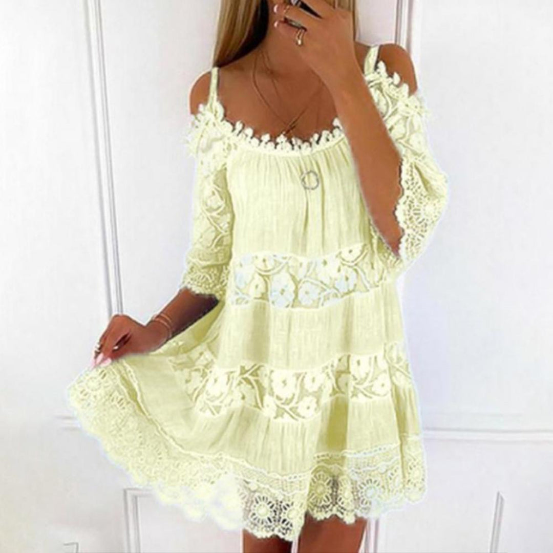 Women's white off-shoulder mini dress with flowy fit and delicate lace panels for summer