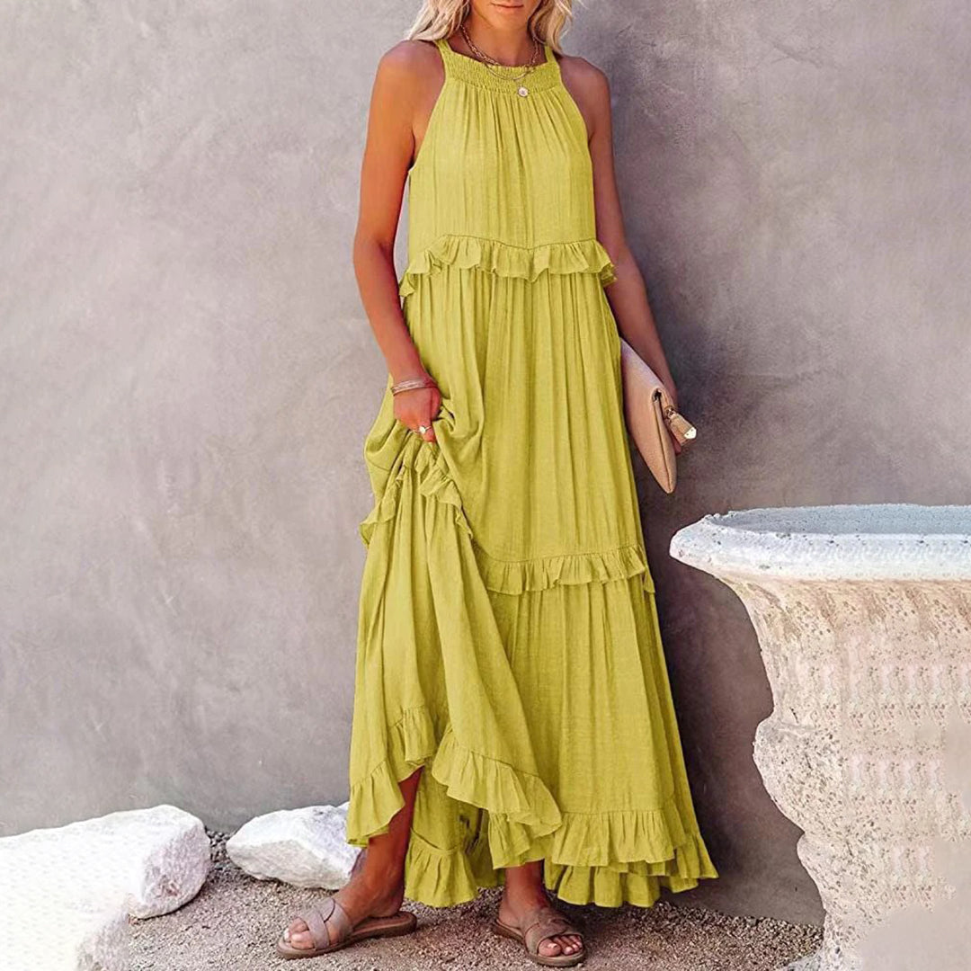 Women's sleeveless halterneck maxi dress in A-line silhouette, breezy summer essential with graceful drape