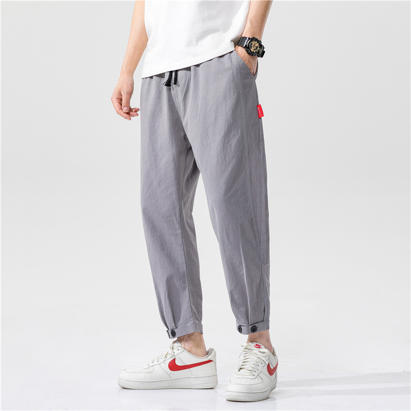 Tapered ankle linen trousers lightweight breathable fabric relaxed tailored cropped silhouette everyday wear