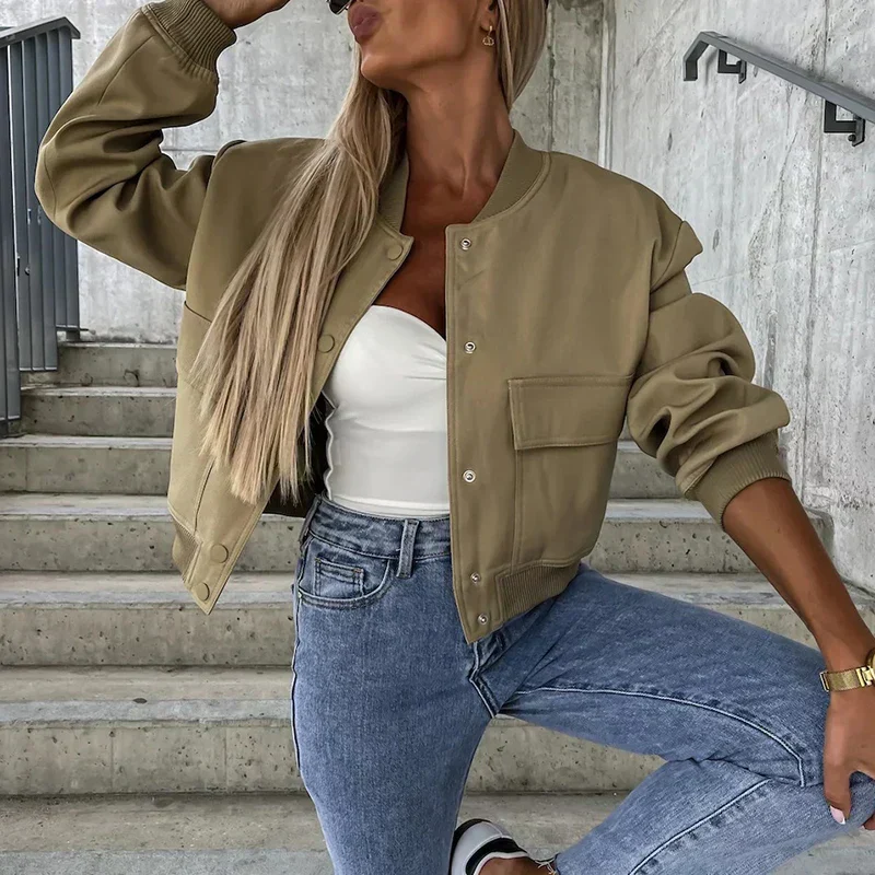 Women's short bomber jacket with snap button closure, flap pockets, casual street style fit