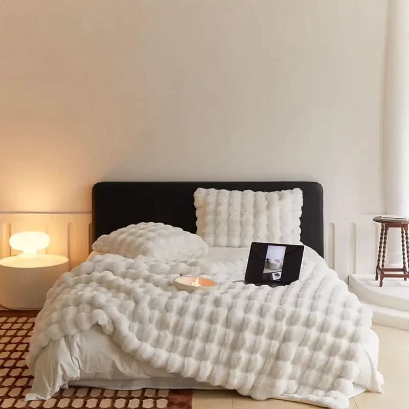 Neutral cream ultra-soft fleece throw blanket with minimalist quilted pattern for cozy sofa styling
