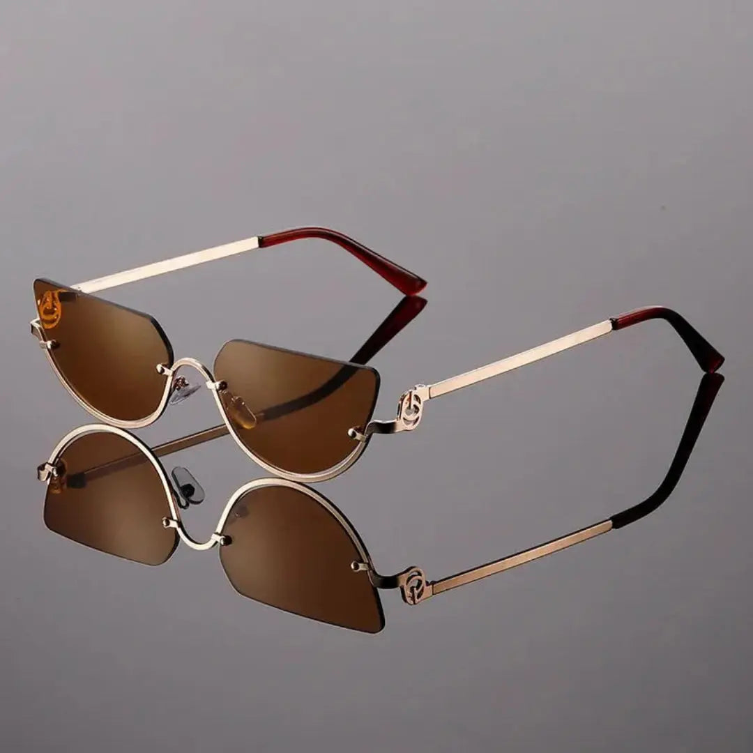 Zania rimless cat-eye tinted sunglasses gold-tone frame bold glam UV protection women