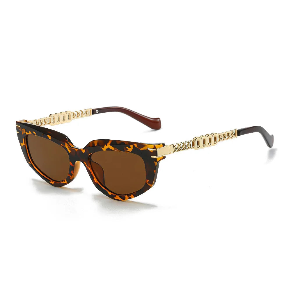 Chunky cat-eye sunglasses gradient brown lenses green ombré tips gold chain-link arms glamorous vintage style