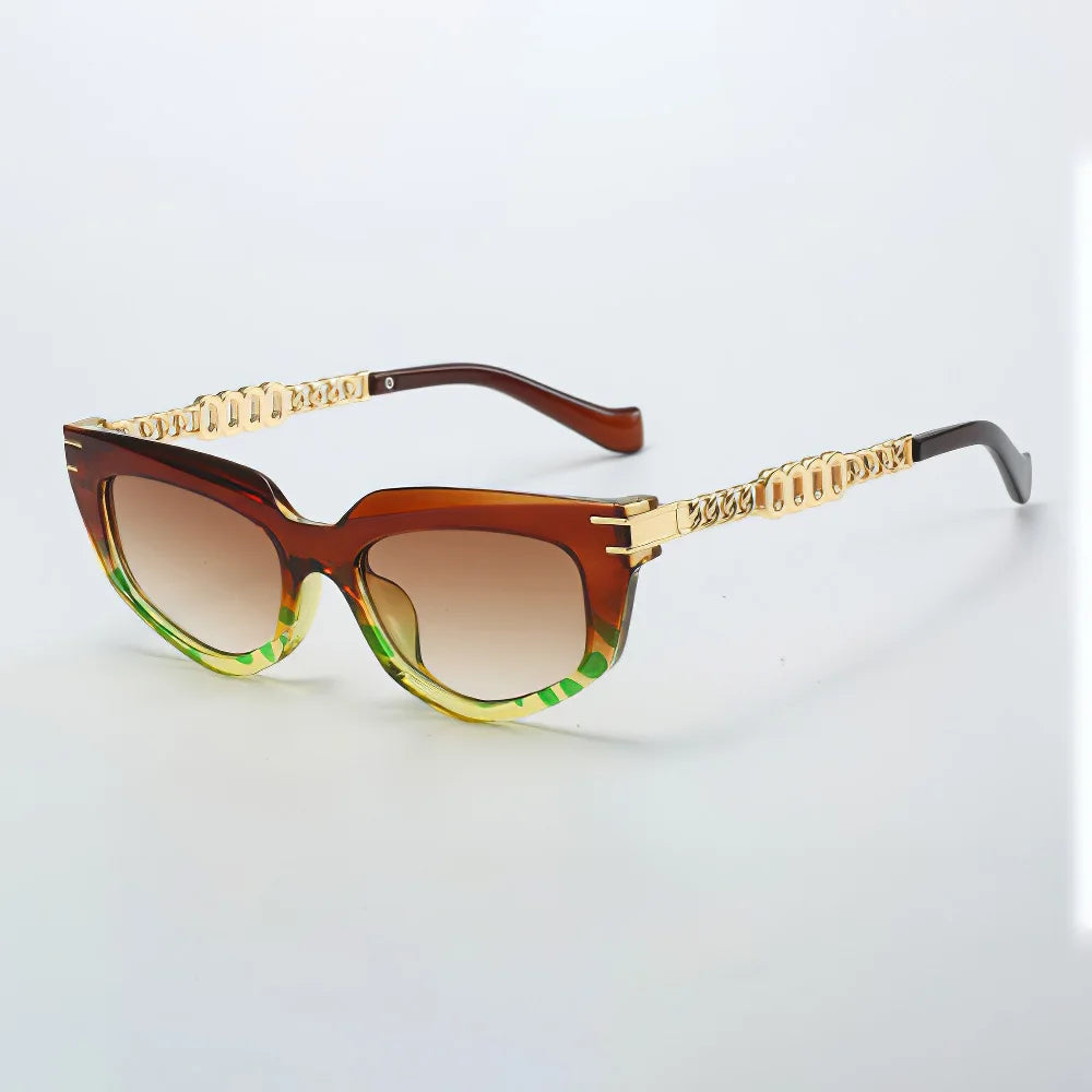 Bold cat-eye sunglasses gold chain arms green ombré tips gradient brown lenses vintage glam style