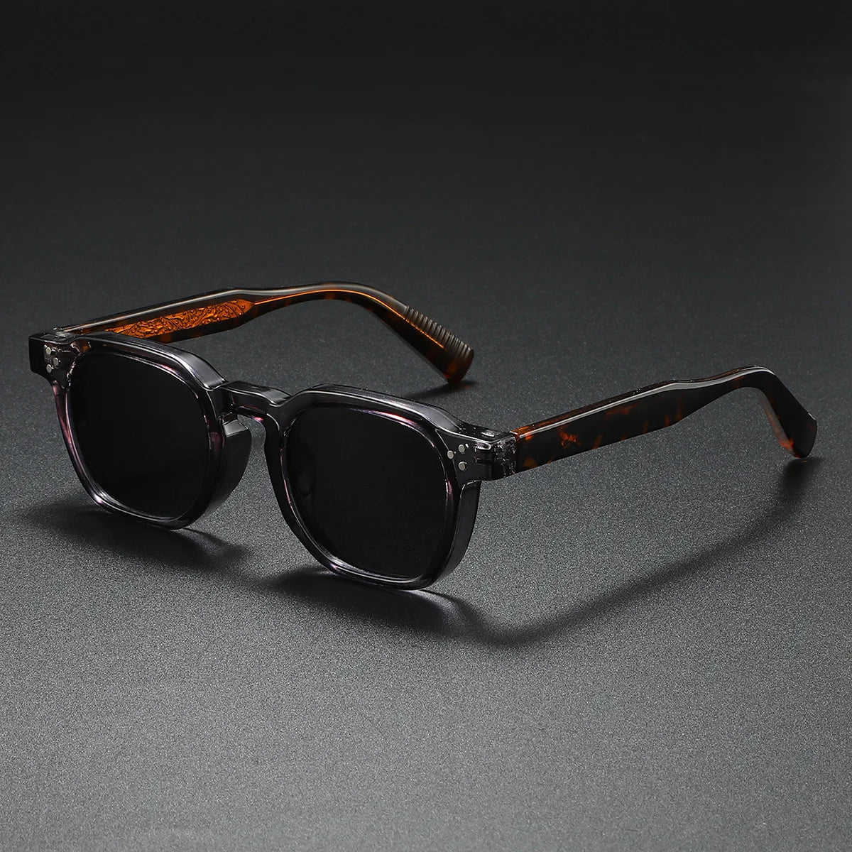 Bold black block-frame acetate sunglasses with thick retro silhouette and UV400 protection