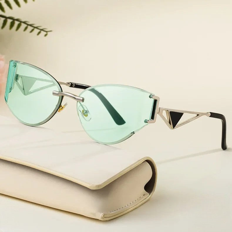 Rimless cat-eye sunglasses geometric metal arms UV protection bold architectural women's fashion
