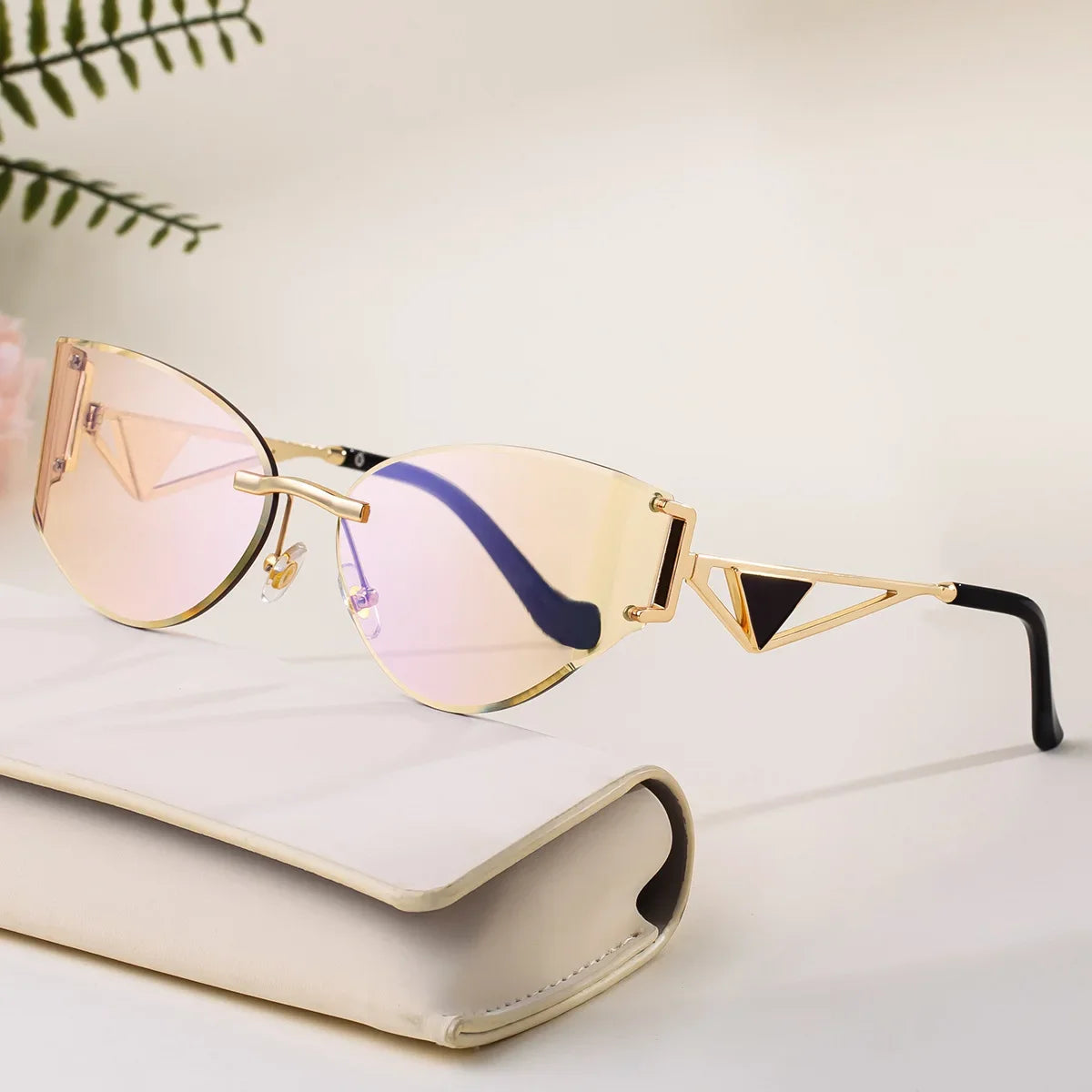 Rimless cat-eye sunglasses geometric metal arms UV protection bold architectural style women