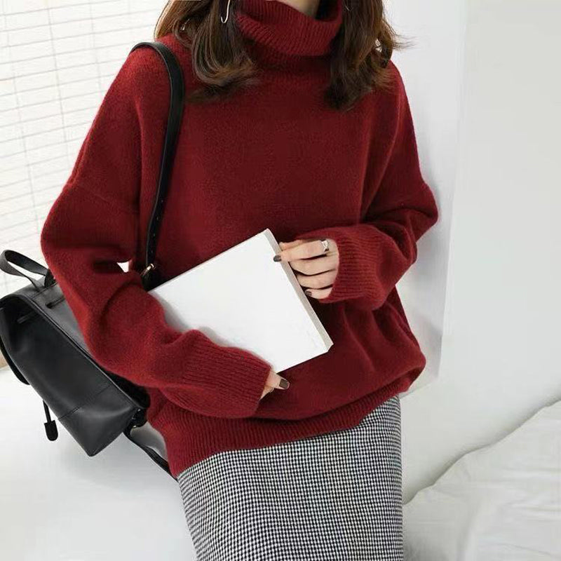 Women's flowy wool turtleneck sweater in natural tones, soft knit with roll-neck detail for autumn