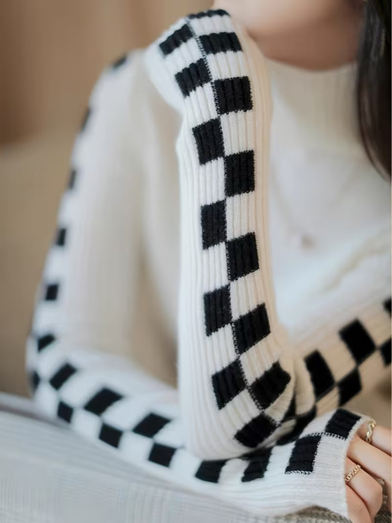Women's beige turtleneck sweater with bold checkerboard sleeves, cotton-blend ultra-soft knit