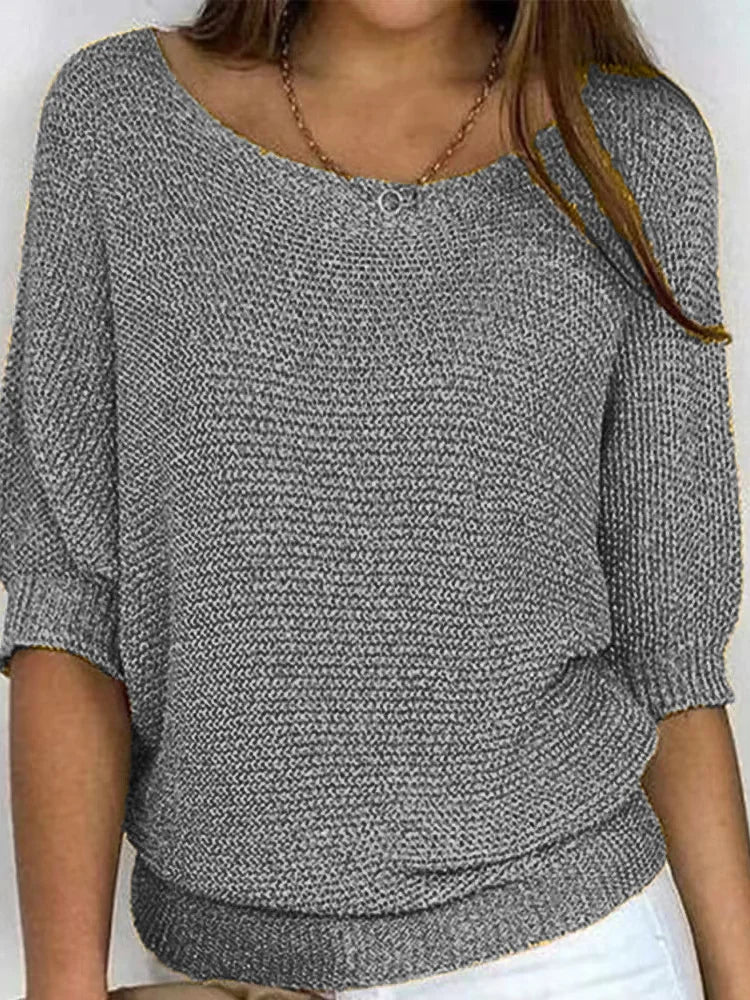 Women's cozy loose-fit knitted sweater with elbow sleeves and boat neckline for casual layering