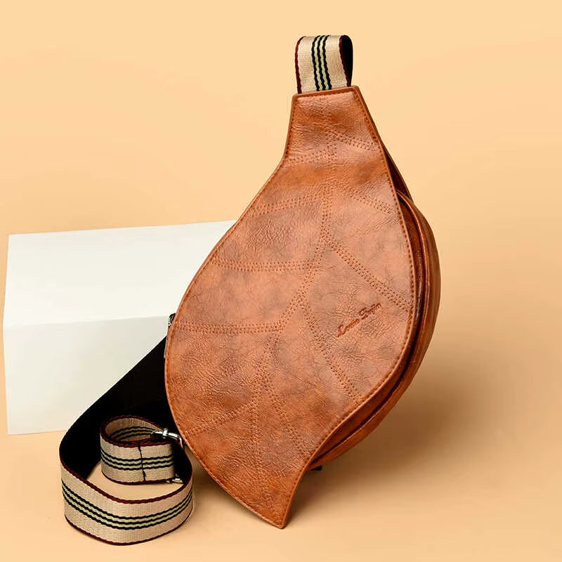Vegan leather leaf-shaped crossbody bag with embossed vein detail and striped strap for women