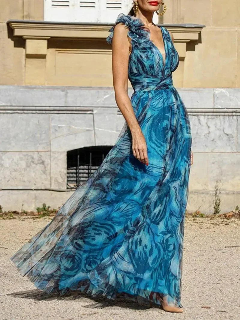 Blue boho maxi dress with plunging neckline and airy ruffled straps for summer evenings