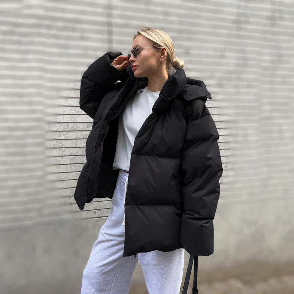 Women's oversized quilted puffer jacket midi length hooded water resistant cozy cold weather coat