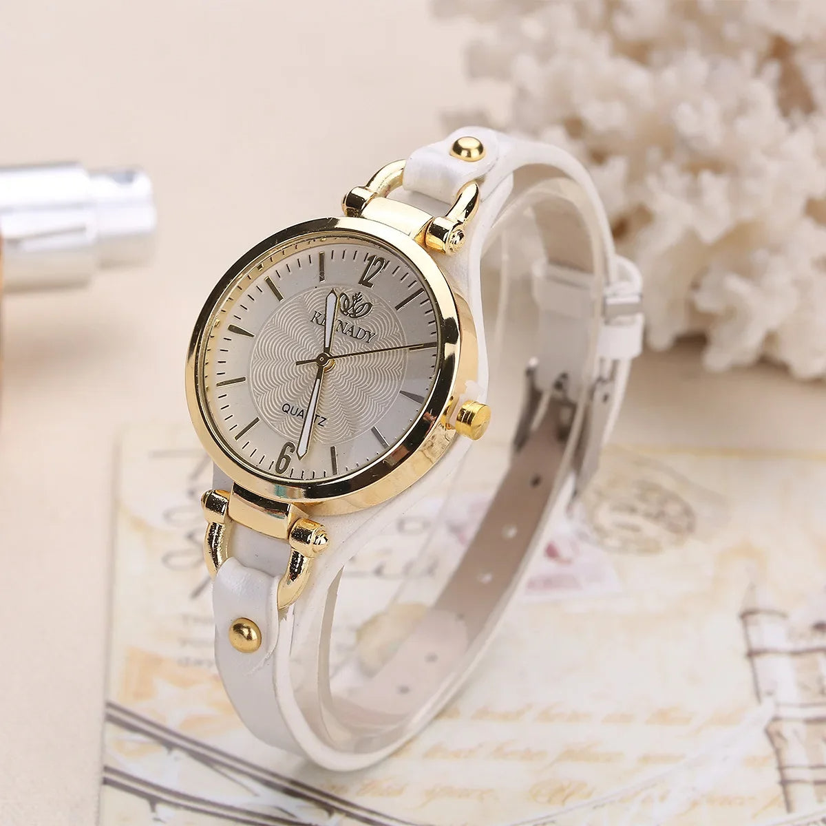 Sophie minimalist quartz watch gold-tone steel case engraved dial vegan leather strap women