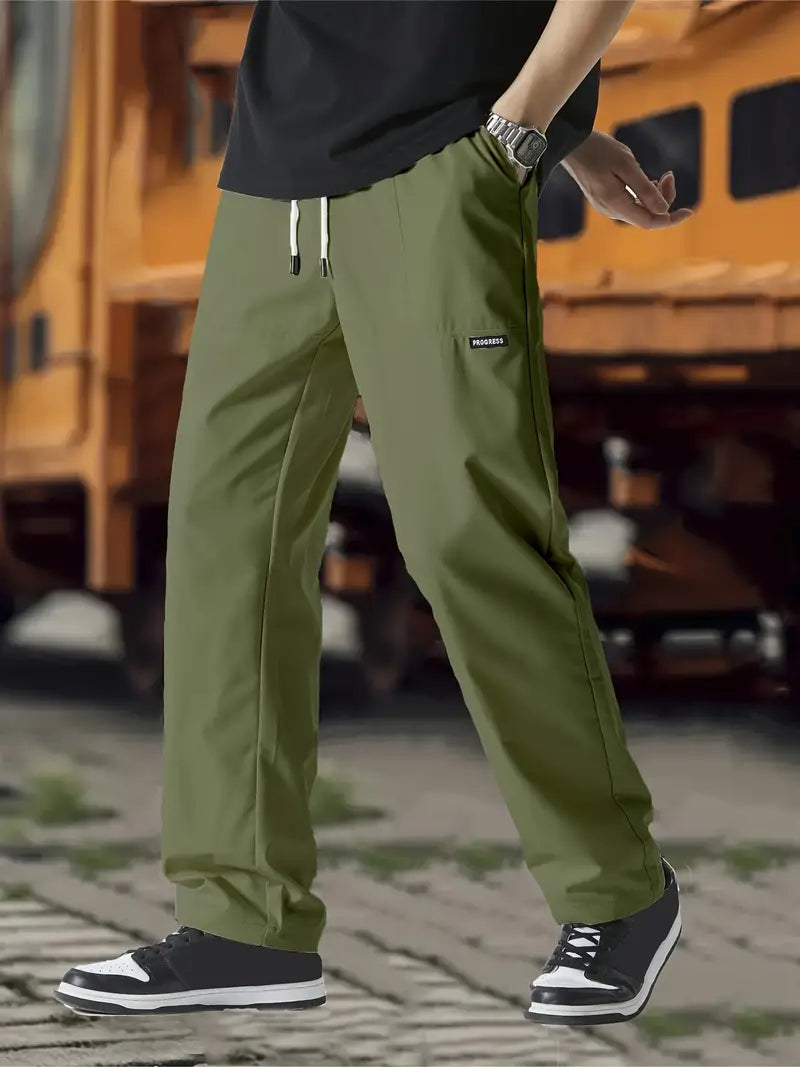 Men's relaxed fit casual pants with adjustable waistband, generous hip and thigh cut for all-day comfort