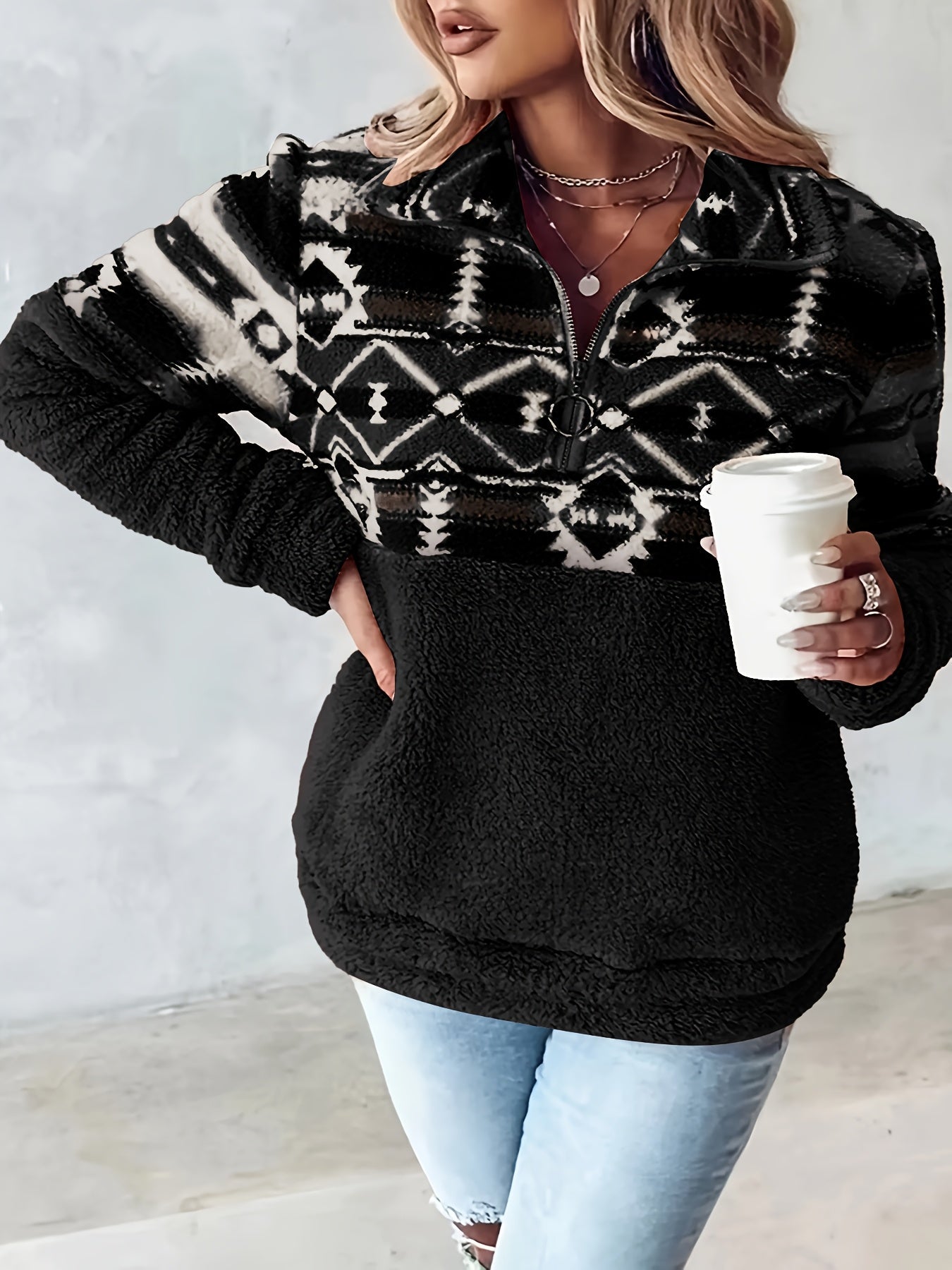 Casual half zip fleece sweater with Aztec pattern accent and kangaroo pocket for winter layering