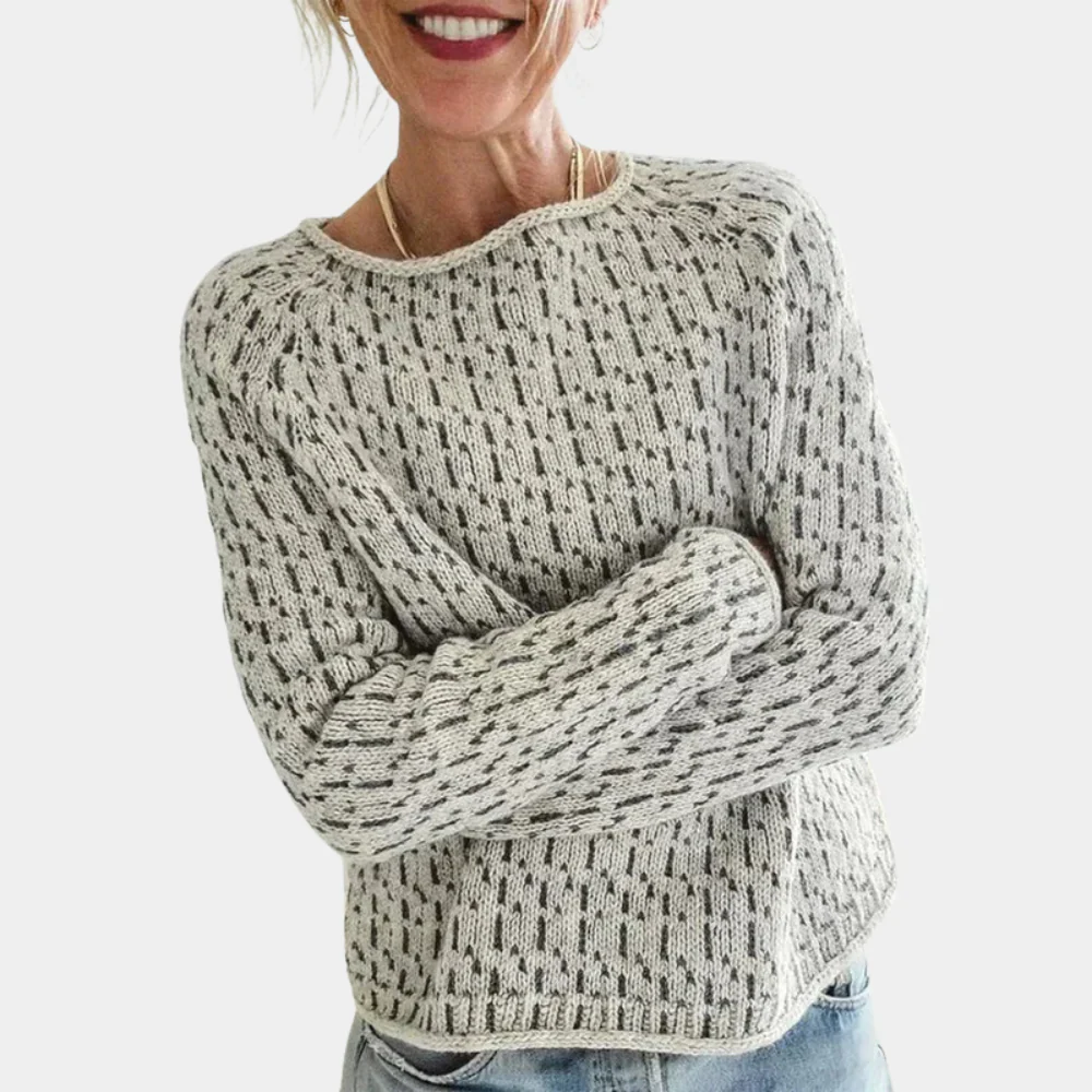 Women's cozy speckled knit sweater in neutral tones, relaxed casual fit, versatile wardrobe essential