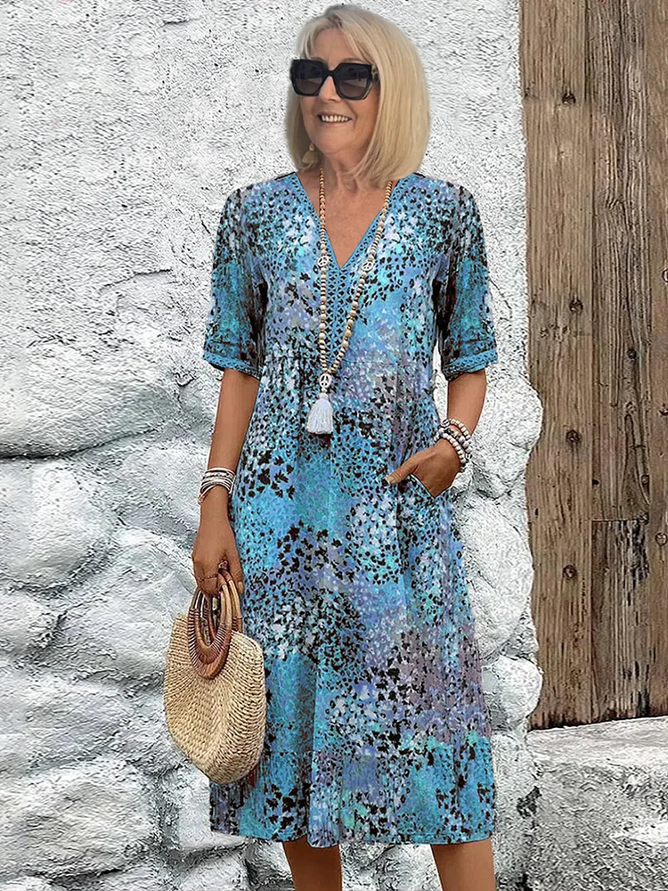 Women's relaxed fit floral print dress in soft tones, flowing silhouette for effortless everyday style