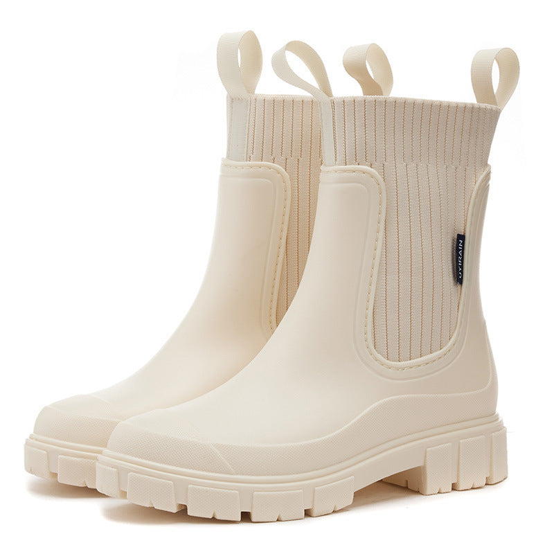 Waterproof rubber Wellington rain boots with non-slip sole, durable all-weather outdoor footwear