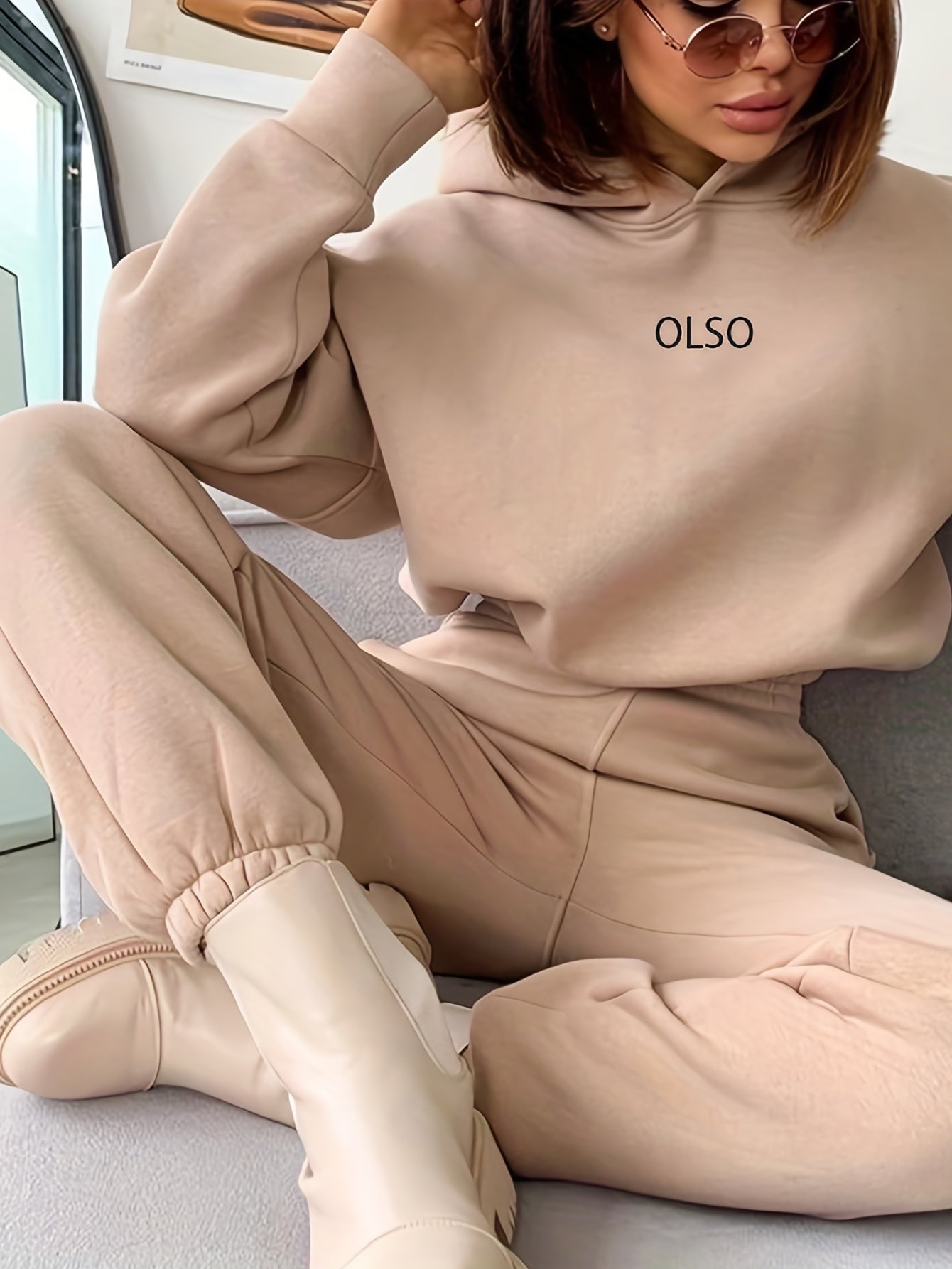 Women's sustainable hoodie and sweatpants two-piece tracksuit set in coordinated casual loungewear style