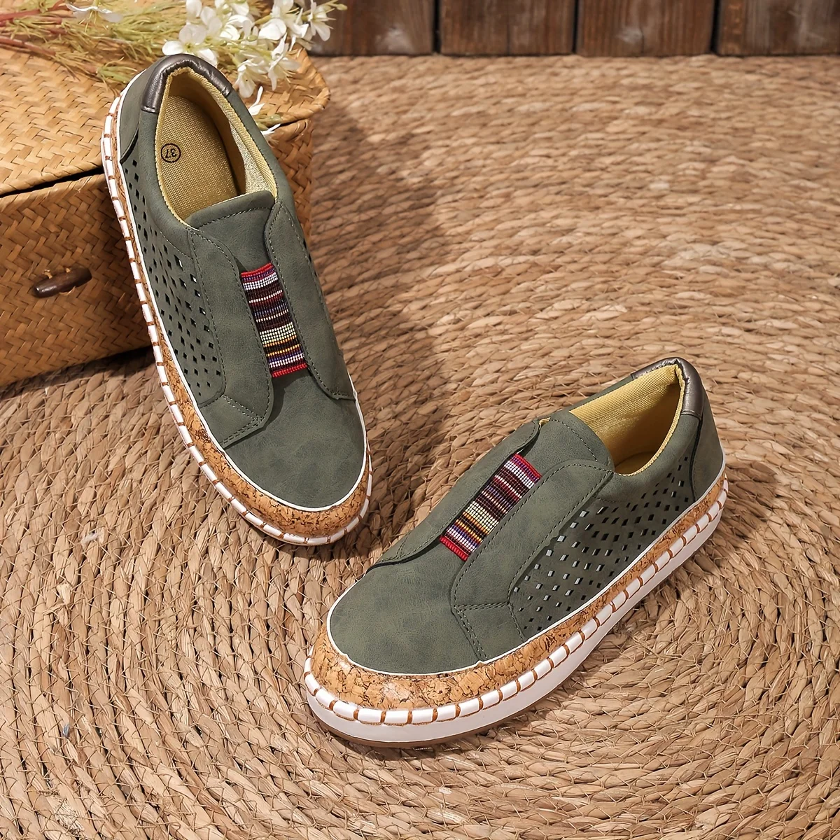Women's tan leather slip-on loafers with perforated cork orthopedic sole and classic silhouette