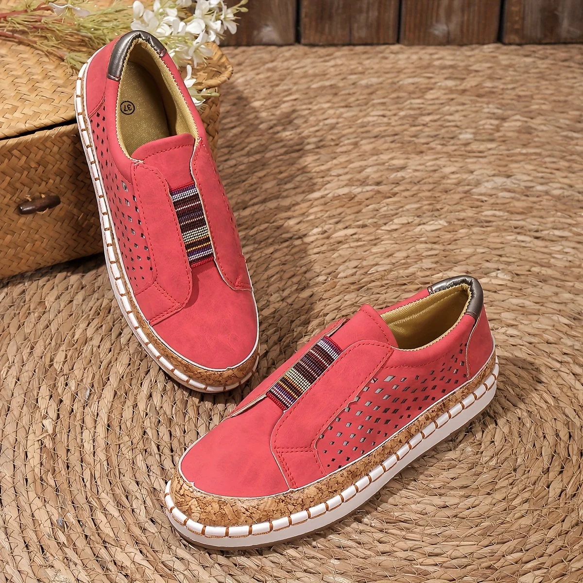 Women's tan leather slip-on loafers with perforated cork orthopedic sole and classic silhouette
