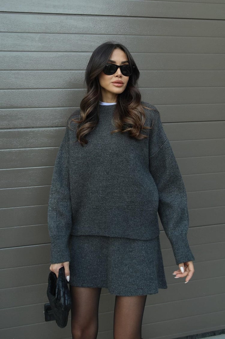 Women's loose-fit minimalist sweater in neutral tone, relaxed silhouette with elegant everyday versatility