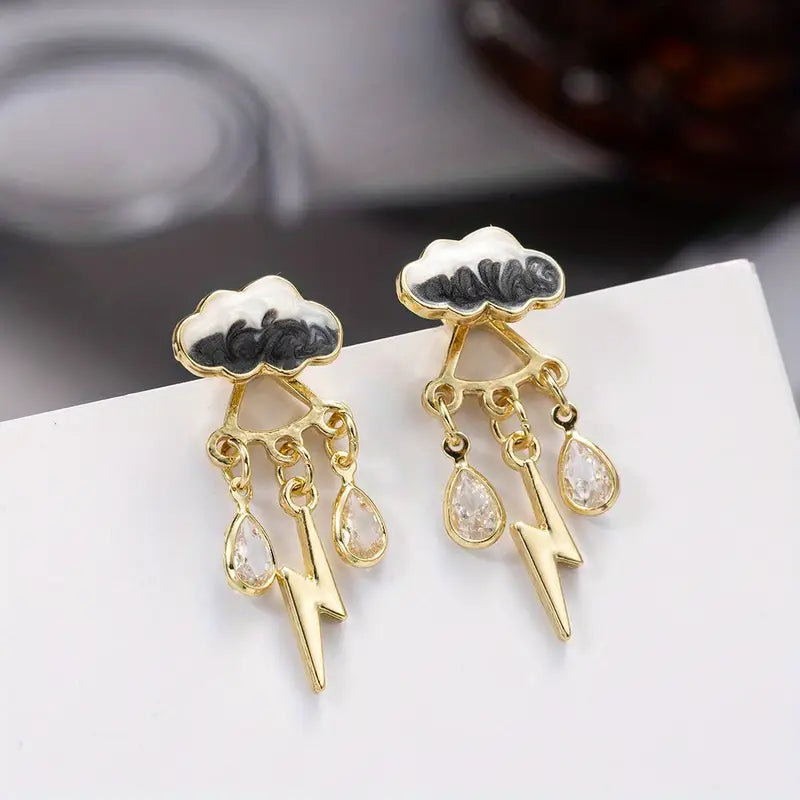 Gold-tone raindrop dangle earrings with swirled enamel clouds and glitter resin drops, lightweight statement jewelry