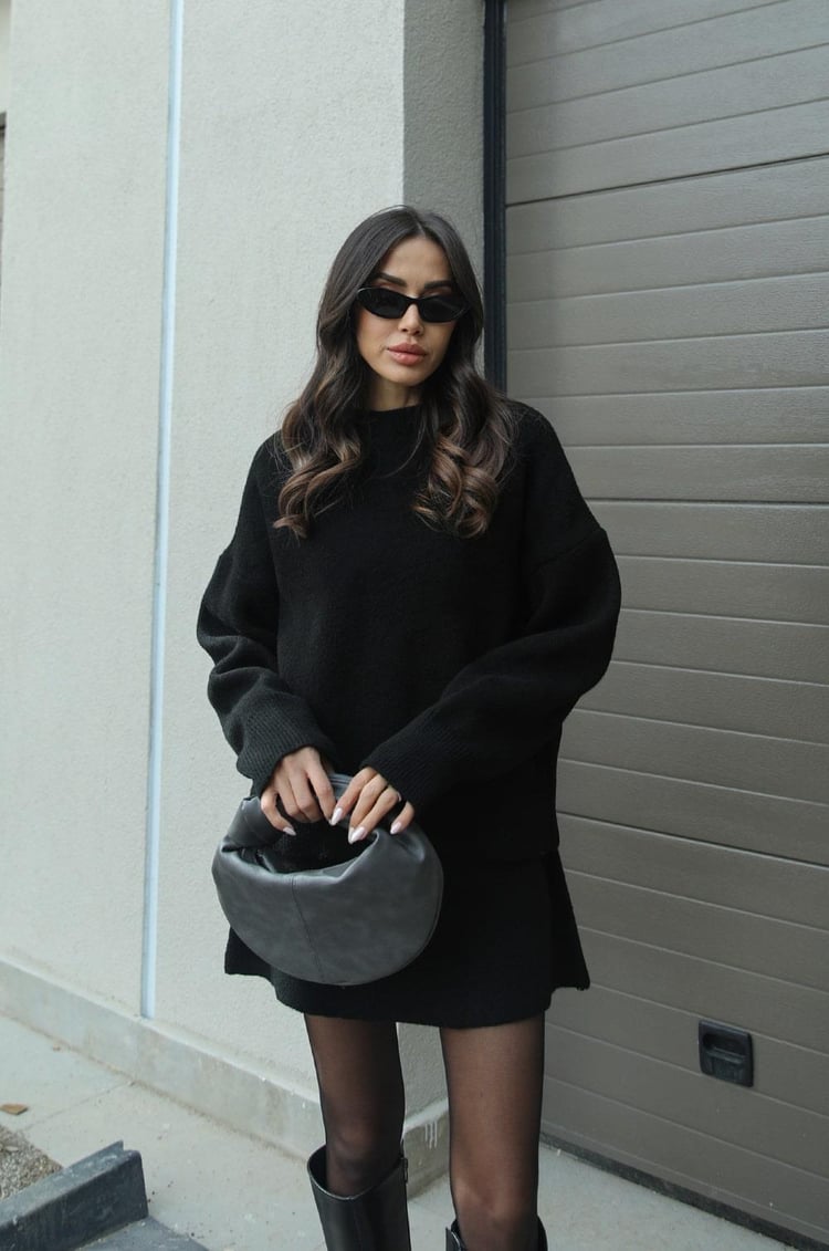 Women's loose-fit minimalist sweater in neutral tone, relaxed silhouette with elegant everyday versatility