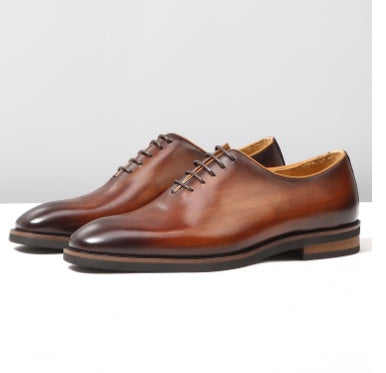 Men's premium leather Oxford shoes in classic black, sleek formal lace-up with smooth refined upper