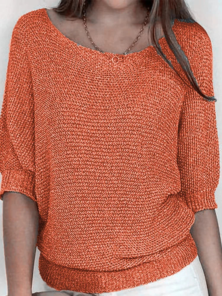 Women's cozy loose-fit knitted sweater with elbow sleeves and boat neckline for casual layering