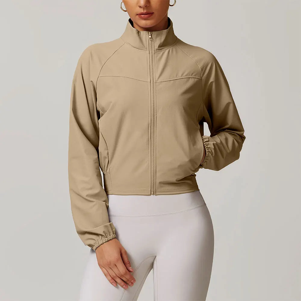 Lightweight black performance jacket with stand-up collar, tailored fit, wind and water resistant stretch woven