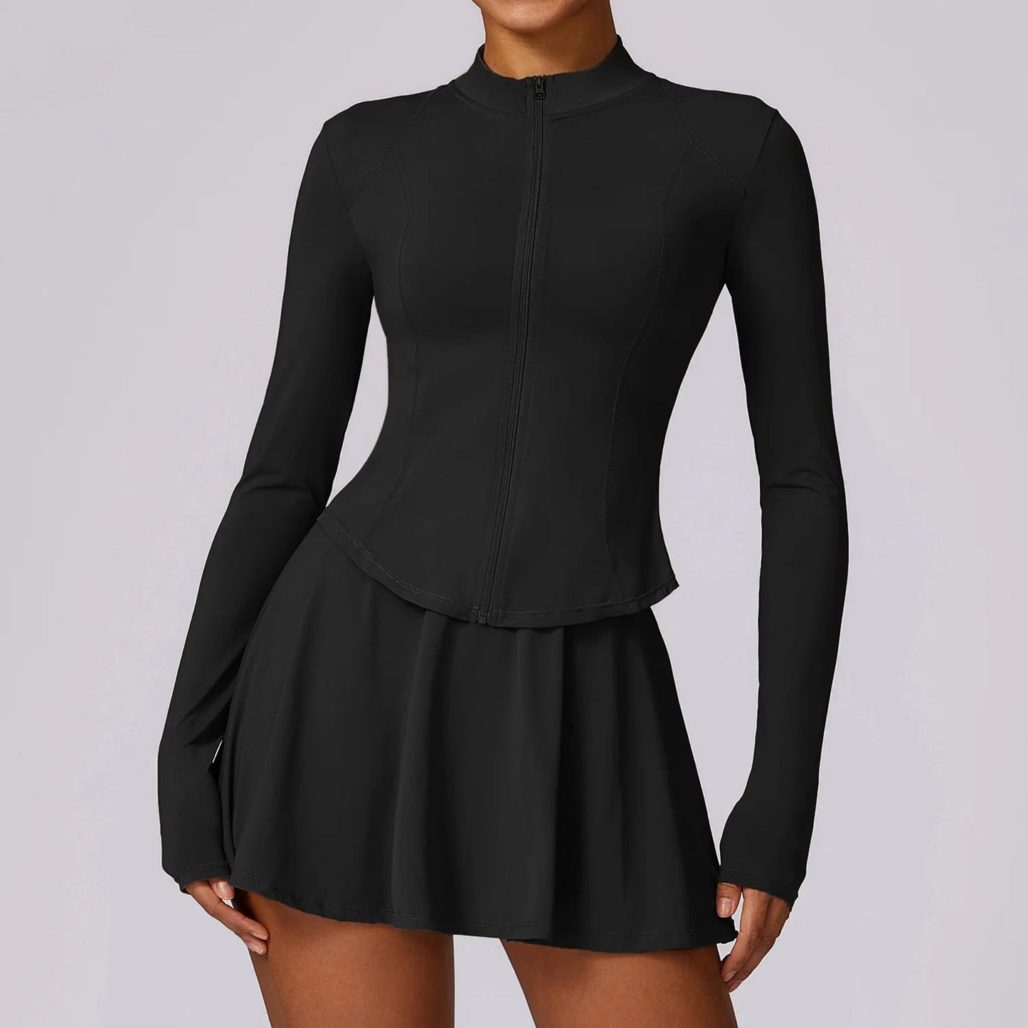 Women's two-piece activewear skirt set with fitted jacket, skater skirt & built-in shorts for gym-to-brunch