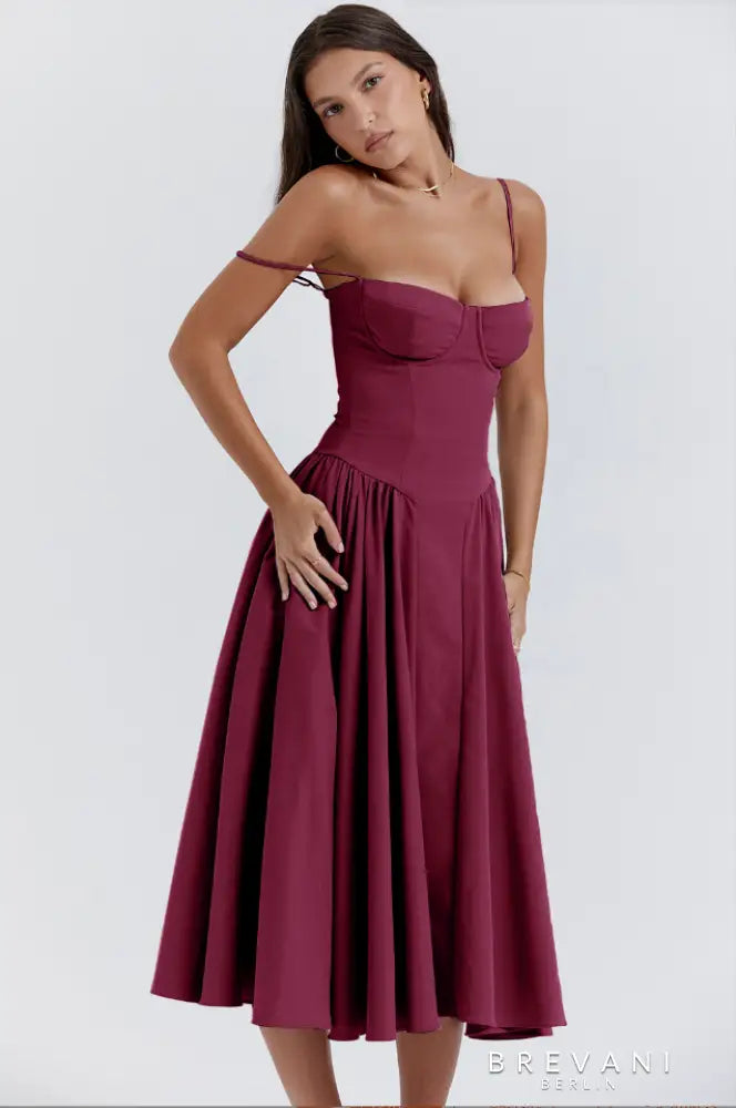 Black corset midi gown with structured boned bodice and flowing skirt for evening wear