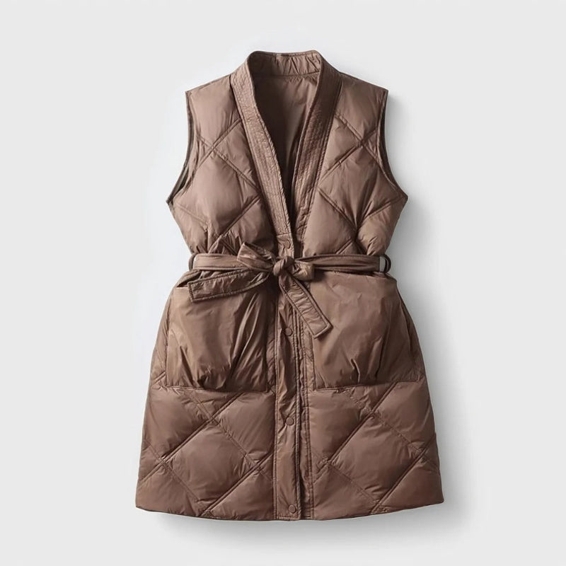 Women's quilted belted mid-thigh vest, chic layering piece with flattering silhouette