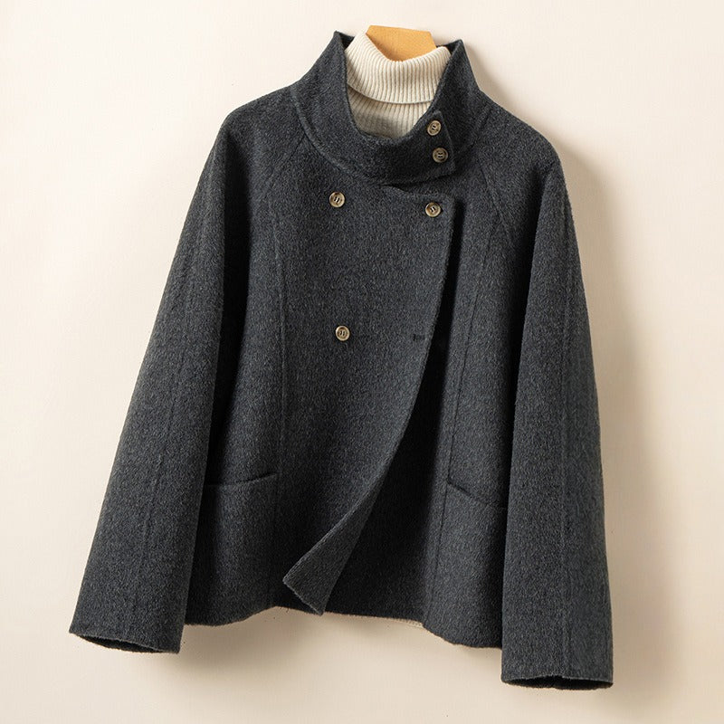 Women's double breasted relaxed wool coat with stand collar, classic tailored silhouette in cozy chic style